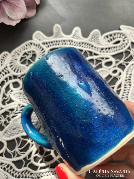 A wonderful rustic, modern ceramic mug with a blue glaze