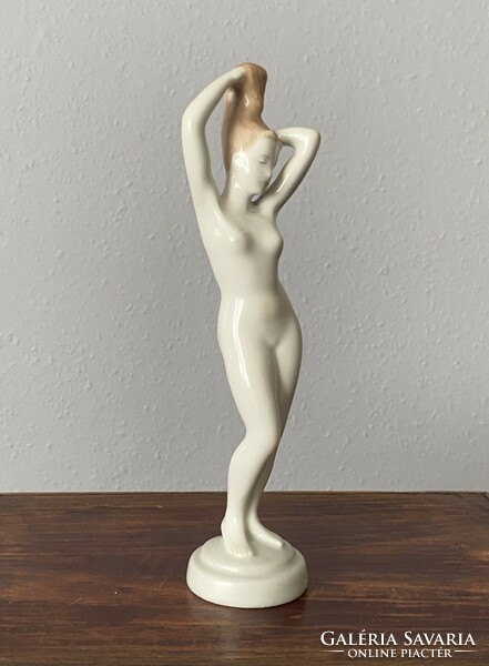 Aquincumi stretching female nude painted porcelain statue 23 cm