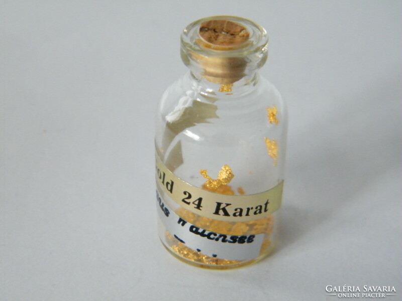 Small bottle containing 24 carat gold