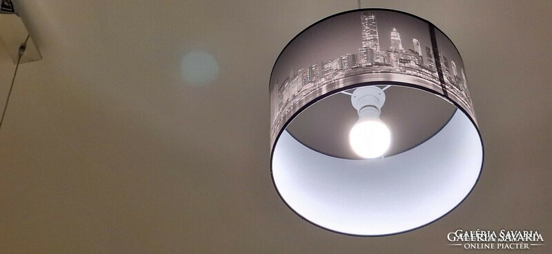 City skyscrapers, black and white ceiling lamp.