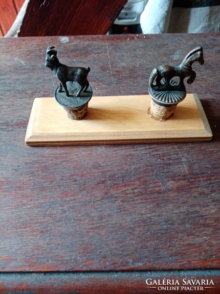 2 antique plugs, on a wooden board