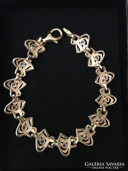 Beautiful, unique gold bracelet with many stones