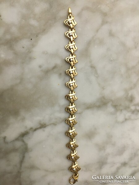 Beautiful, unique gold bracelet with many stones