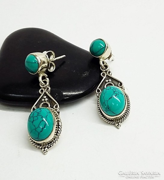 Silver dangling earrings with a turquoise stone