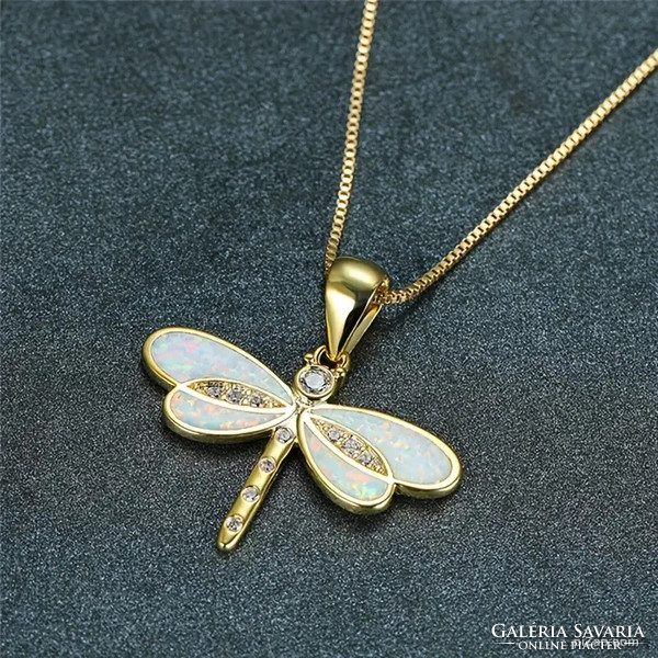 Fairy dragonfly pendant on a cube-shaped gold-colored chain.