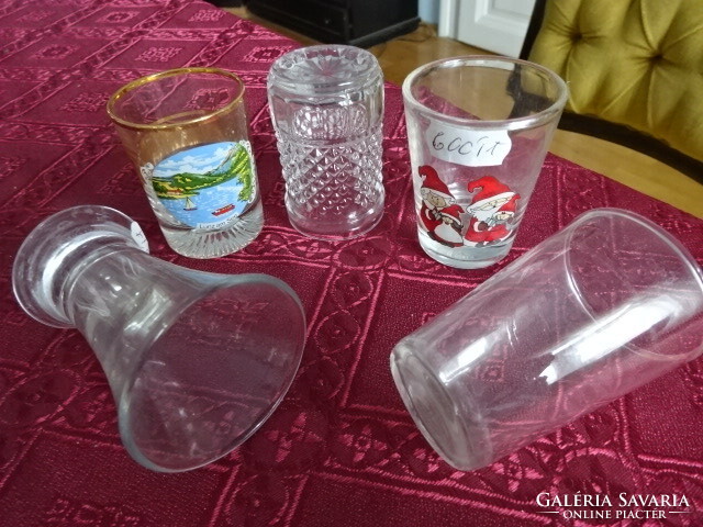 Five brandy cups, all different, one of them has a pair of Santa Clauses on it. He has!