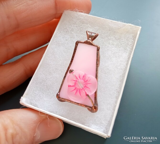 Handmade glass jewelry with a large glass bead on pink glass