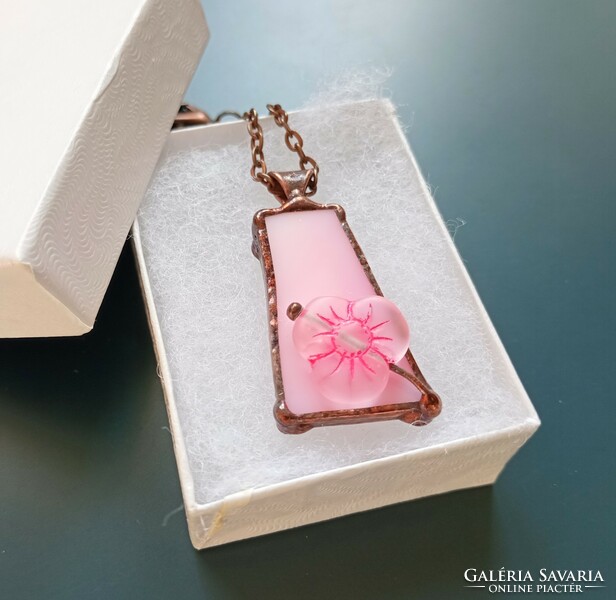 Handmade glass jewelry with a large glass bead on pink glass