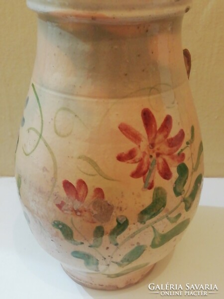Old jug with floral pattern, straw