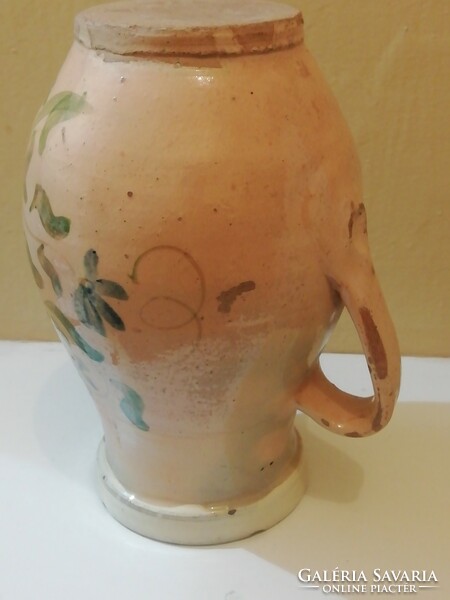 Old jug with floral pattern, straw