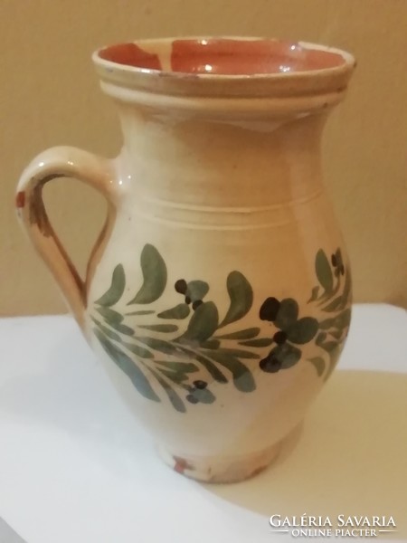 Old beige jug, straw