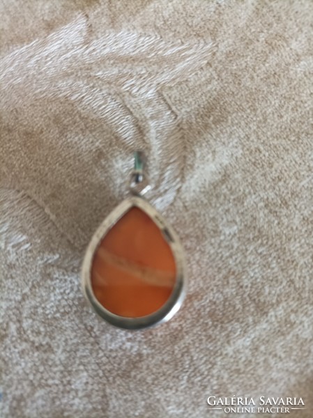Mineral pendant in a silver frame /sunstone or jade/
