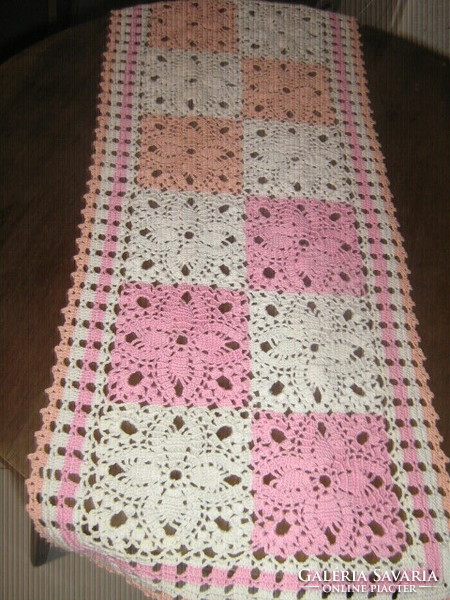 Beautiful hand-crocheted white-pink-orange tablecloth with floral pattern
