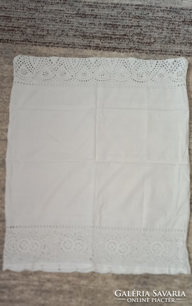 Embroidered pillow cover has wide embroidery on the 2 short edges