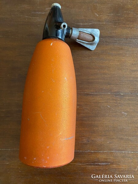 Old soda bottle, in good condition. 1 Liter. It is orange in color.