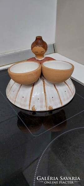 Ceramic figurine of a girl with a bowl