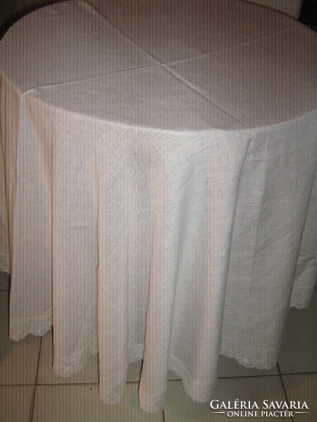 Beautiful white round woven tablecloth with floral lace edge