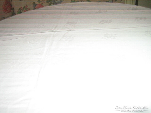 Beautiful floral pattern on white antique damask tablecloth