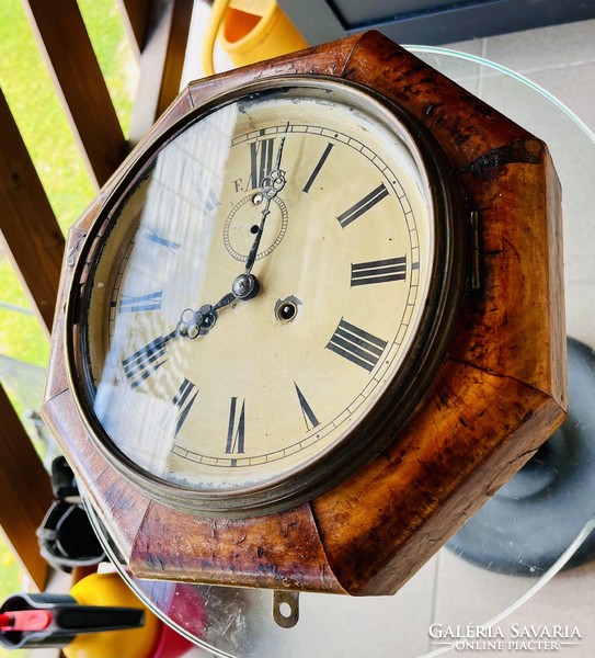 Antique half-baked wall clock, ship's clock
