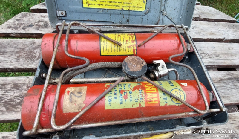 Old, retro Russian portable camping gas stove in original metal box, with travel tags