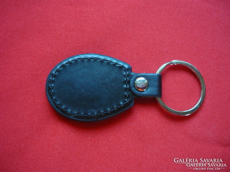 Cagiva oval metal key ring on a leather base