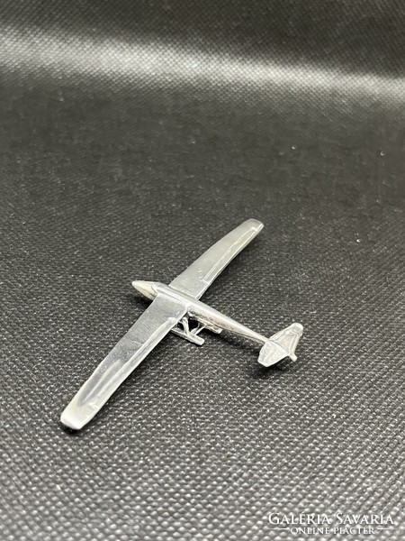Silver miniature airplane
