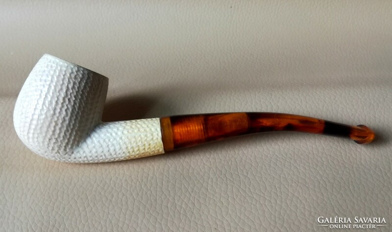 A meerschaum pipe carved with a small ribbed pattern, a top pipe
