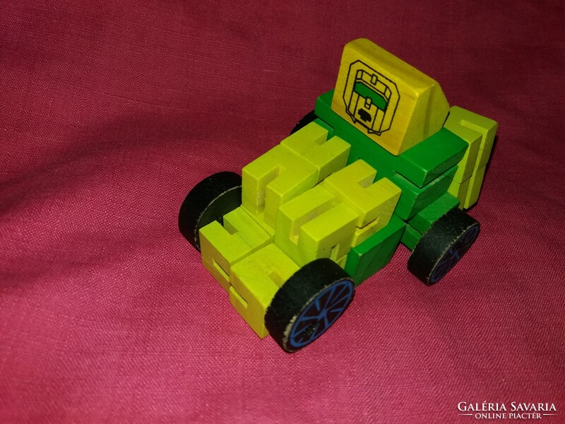 Érdekes fából készült TRANSFORMERS figura rengeteg variációs lehetőség, szép állapot a képek szerint