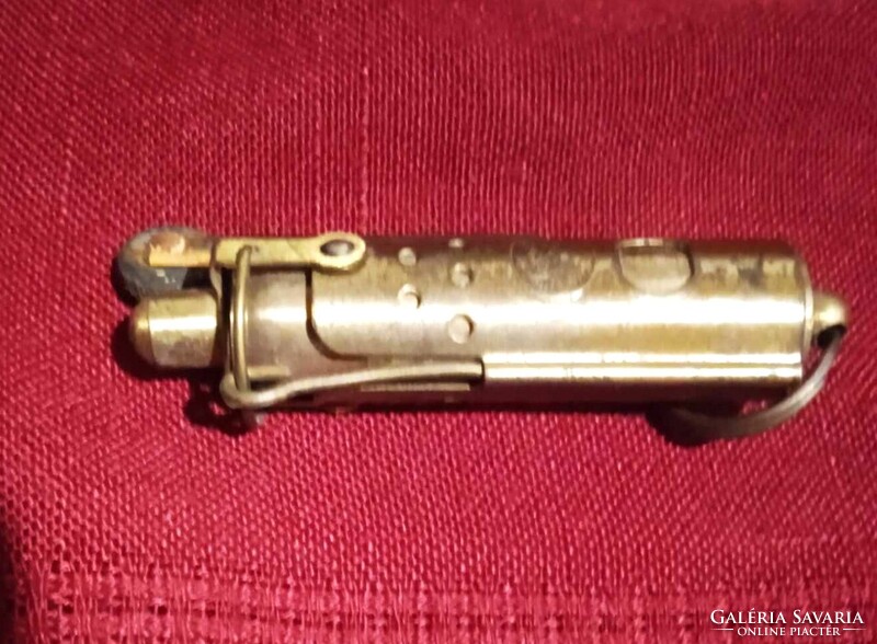 Old brass lighter that works and is 6 1/2  inches long