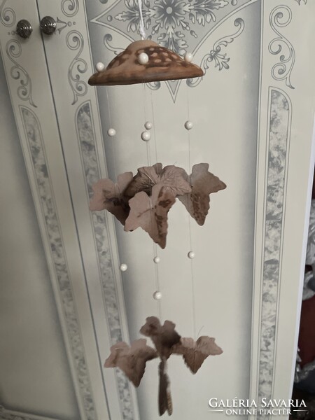 A unique, fairy-like ceramic wind chime.