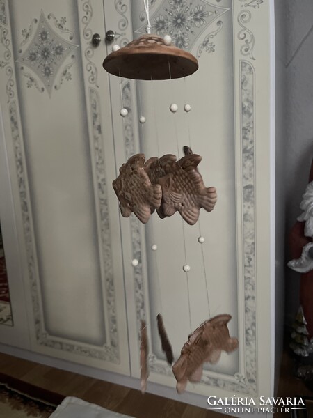 A unique, fairy-like ceramic wind chime.
