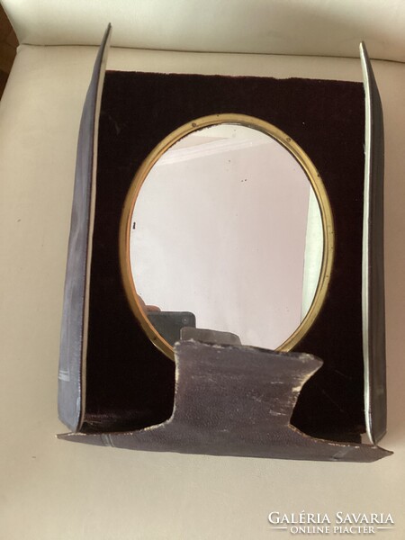 Antique, oval table mirror with velvet-covered frame and matching leather case.