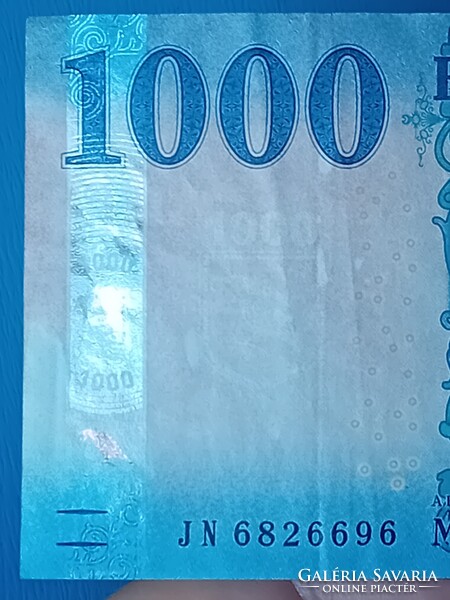 2023 évi 1000 Forintos, jelentős nyomdahibával.