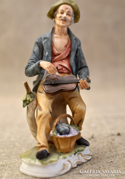 Vintage porcelain street musician figurine
