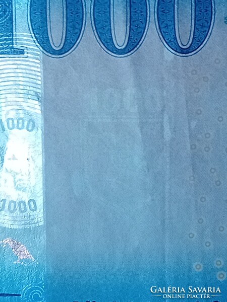 2023 évi 1000 Forintos, jelentős nyomdahibával.
