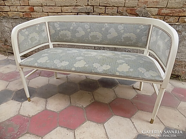 Thonet-style upholstered sofa.