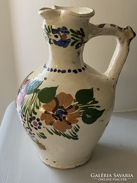 Old floral pattern rattle jug